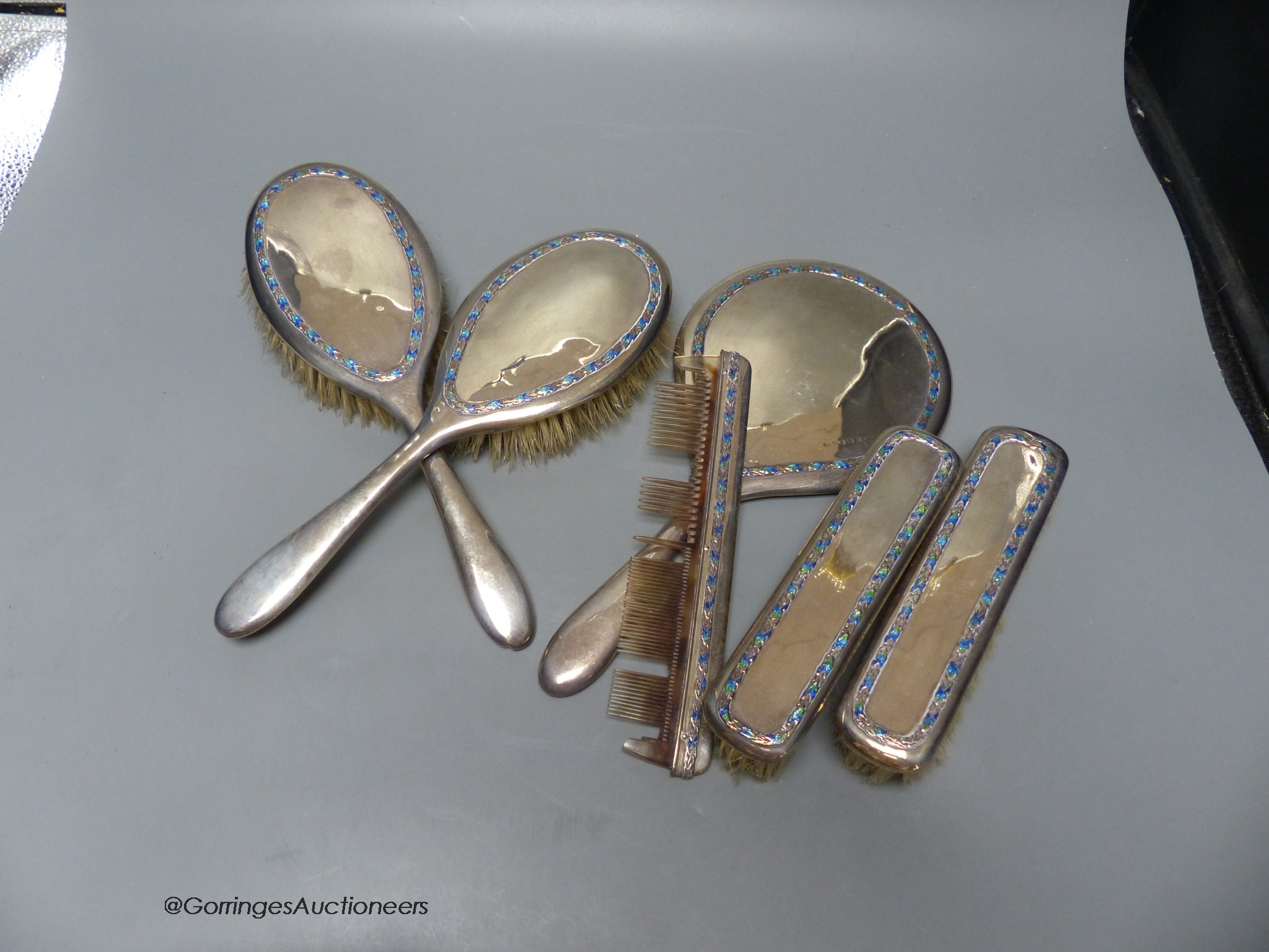 A George V six piece silver and enamel dressing set, by Liberty & Co, Birmingham, 1913 (a.f.).